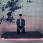 A butterfly painted on the wall behind SeokJin in Run Japanese ver. MV