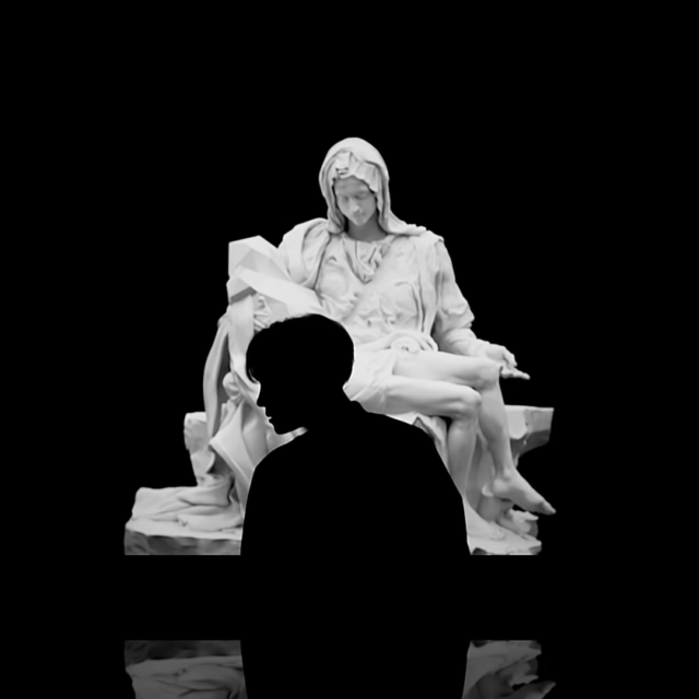 j-hope in front of a look-alike Pietà by Michelangelo (Blood, Sweat & Tears)
