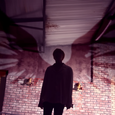Wings appearing as a shadow behind j-hope (Boy Meets Evil)